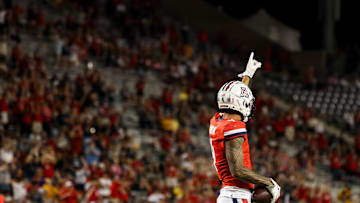 Oct 26, 2024; Tucson, Arizona, USA; Arizona Wildcats wide receiver Tetairoa McMillan (4) celebrates a first down against the West Virginia Mountaineers during the fourth quarter at Arizona Stadium. Mandatory Credit: Aryanna Frank-Imagn Images