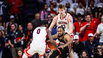 Feb 15, 2025; Tucson, Arizona, USA; Arizona Wildcats guard Jaden Bradley (0) steals the ball from Houston Cougars forward J’Wan Roberts (13) during the second half at McKale Center. Mandatory Credit: Aryanna Frank-Imagn Images
