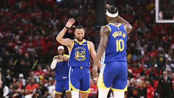 Apr 20, 2025; Houston, Texas, USA; Golden State Warriors guard Stephen Curry (30) celebrates with forward Jimmy Butler III (10) after a play during the third quarter against the Houston Rockets at Toyota Center. Mandatory Credit: Troy Taormina-Imagn Images