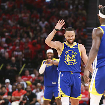 Apr 20, 2025; Houston, Texas, USA; Golden State Warriors guard Stephen Curry (30) celebrates with forward Jimmy Butler III (10) after a play during the third quarter against the Houston Rockets at Toyota Center. Mandatory Credit: Troy Taormina-Imagn Images