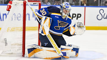 Apr 3, 2025; St. Louis, Missouri, USA;  St. Louis Blues goaltender Joel Hofer (30) defends the net against the Pittsburgh Penguins during the third period at Enterprise Center. Mandatory Credit: Jeff Curry-Imagn Images