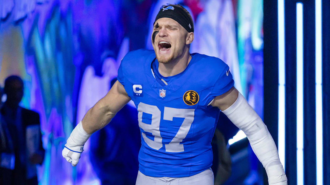 Nov 27, 2025; Detroit, Michigan, USA; Detroit Lions defensive end Aidan Hutchinson (97) runs onto the field prior to the game against the Green Bay Packers at Ford Field. Mandatory Credit: David Reginek-Imagn Images