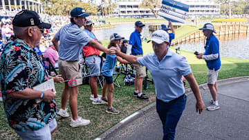 Bud Cauley gives a fist bump to a fan after making birdie on seventeen during the third round of the Players Championship at TPC Sawgrass in Ponte Vedra Beach, Fl. Saturday March 15, 2025. [Doug Engle/Florida Times-Union]