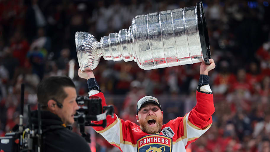 Florida Panthers center Sam Bennett hoists the Stanley Cup after winning Game 6 of the 2025 Stanley Cup Final against the Edmonton Oilers at Amerant Bank Arena. | Sam Navarro-Imagn Images