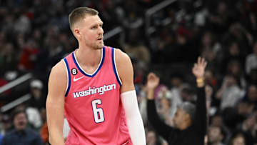 Mar 28, 2023; Washington, District of Columbia, USA; Washington Wizards center Kristaps Porzingis (6) reacts after a basket against the Boston Celtics during the second half at Capital One Arena. Mandatory Credit: Brad Mills-Imagn Images