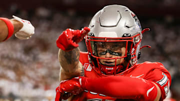 Aug 31, 2024; Tucson, Arizona, USA; New Mexico wide receiver Luke Wysong (15) celebrates touchdown during first quarter at Arizona Stadium. Mandatory Credit: Aryanna Frank-Imagn Images