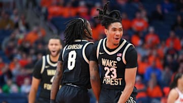 Wake Forest Demon Deacons guard Hunter Sallis reacts with teammate guard Ty-Laur Johnson during the first half against the Syracuse Orange at the JMA Wireless Dome on December 31, 2024.