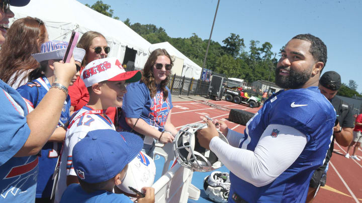 Bills defensive lineman Gable Steveson signs autographs for fans following the Buffalo Bills' training camp.