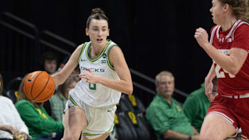 Oregon’s Elisa Mevius, left, brings the ball down court against Wisconsin at Matthew Knight Arena in Eugene Thursday, Jan. 4, 2025.