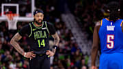 Apr 29, 2024; New Orleans, Louisiana, USA; New Orleans Pelicans forward Brandon Ingram (14) looks on against Oklahoma City Thunder guard Luguentz Dort (5) during the first half of game four of the first round for the 2024 NBA playoffs at Smoothie King Center. 