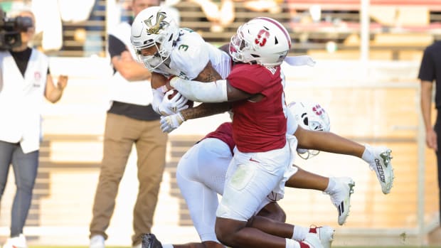 Sacramento State Hornets wide receiver Chris Miller (3) is tackled by Stanford Cardinal linebacker Gaethan Bernadel