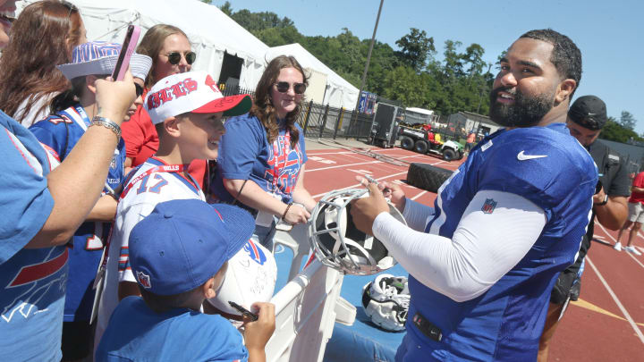 Bills defensive lineman Gable Steveson signs autographs for fans following the Buffalo Bills training camp.