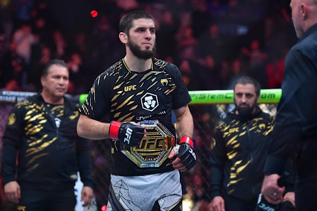 Islam Makhachev (red gloves) reacts after defeating Renato Moicano (not pictured) in a lightweight title fight during UFC 311