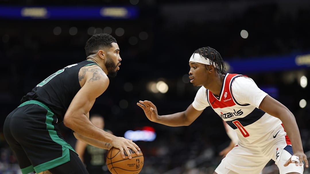 Oct 24, 2024; Washington, District of Columbia, USA; Boston Celtics forward Jayson Tatum (0) prepares to shoot the ball as Washington Wizards guard Bilal Coulibaly (0) defends in the first half at Capital One Arena. Mandatory Credit: Geoff Burke-Imagn Images