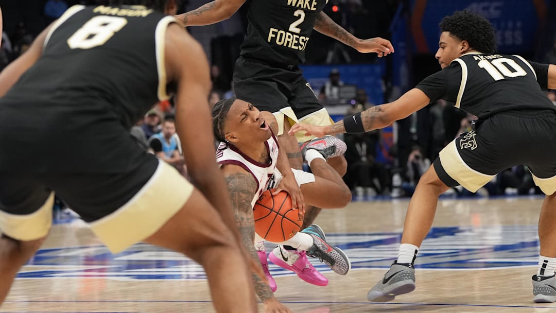 Mar 10, 2026; Charlotte, NC, USA; Virginia Tech Hokies guard Ben Hammond (3) is fouled as Wake Forest Demon Deacons guard Sebastian Akins (10) and guard Mekhi Mason (8) defend in the second half at Spectrum Center. Mandatory Credit: Bob Donnan-Imagn Images