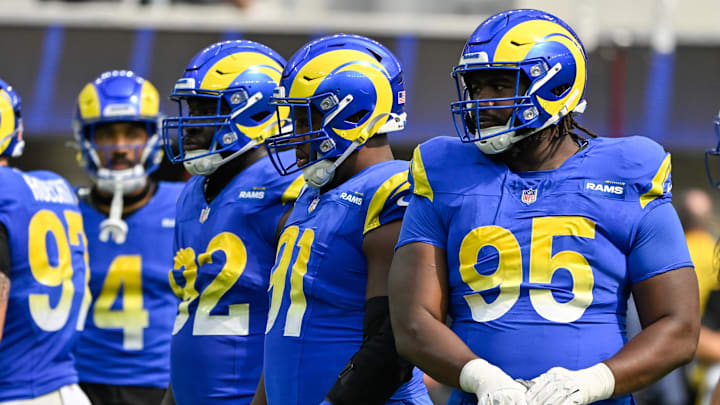 Oct 6, 2024; Inglewood, California, USA; Los Angeles Rams defensive tackle Neville Gallimore (92), defensive tackle Kobie Turner (91) and Rams defensive tackle Bobby Brown III (95) during the second quarter against the Green Bay Packers  at SoFi Stadium. Mandatory Credit: Robert Hanashiro-Imagn Images