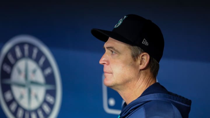 Apr 20, 2022; Seattle, Washington, USA;  Seattle Mariners special coordinator Dan Wilson stands in the dugout while filling in as support due to manager Scott Servais and first base coach Manny Acta testing positive for COVID-19 before the game against the Texas Rangers at T-Mobile Park. Mandatory Credit: Lindsey Wasson-USA TODAY Sports