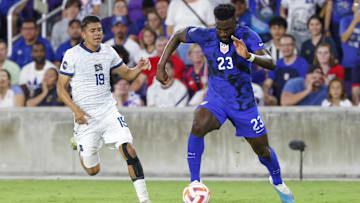 Mar 27, 2023; Orlando, Florida, USA; El Salvador forward Kevin Reyes (19) chases United States of America forward Daryl Dike (23) during the first half at Exploria Stadium. Mandatory Credit: Reinhold Matay-Imagn Images