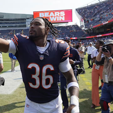 Jonathan Owens celebrates with fans on the way to the locker room after his TD on a blocked punt return sparked a win.