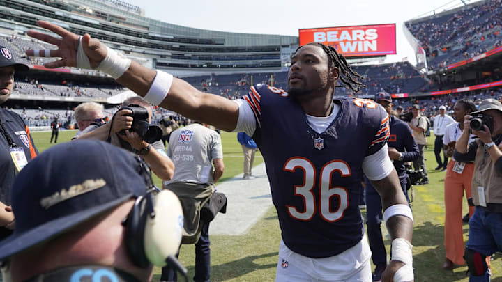 Jonathan Owens celebrates with fans on the way to the locker room after his TD on a blocked punt return sparked a win.