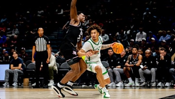 Nov 26, 2024; Las Vegas, Nevada, USA; Oregon Ducks guard Jadrian Tracey (2) is blocked by Texas A&M forward Pharrel Payne (21) during the first half at MGM Grand Garden Arena. Mandatory Credit: Jeffrey (Tyge) O'Donnell-Imagn Images