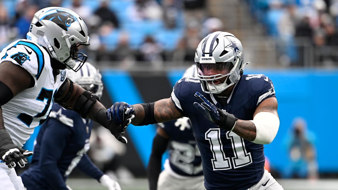 Dec 15, 2024; Charlotte, North Carolina, USA;  Dallas Cowboys linebacker Micah Parsons (11) rushes as Carolina Panthers offensive tackle Taylor Moton (72) defends in the first quarter at Bank of America Stadium. Mandatory Credit: Bob Donnan-Imagn Images