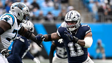 Dec 15, 2024; Charlotte, North Carolina, USA;  Dallas Cowboys linebacker Micah Parsons (11) rushes as Carolina Panthers offensive tackle Taylor Moton (72) defends in the first quarter at Bank of America Stadium. Mandatory Credit: Bob Donnan-Imagn Images