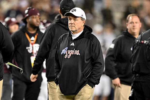 Jimbo Fisher looks on during warmups of a Texas A&M game in 2023.