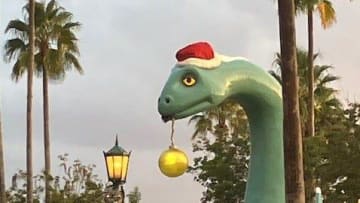 Gertie, of Gertie's Ice Cream of Extinction Fame, gets the merry on beside Echo Lake at Walt Disney