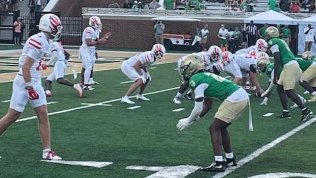 Milton's Derrick Baker takes a snap near his own end zone.