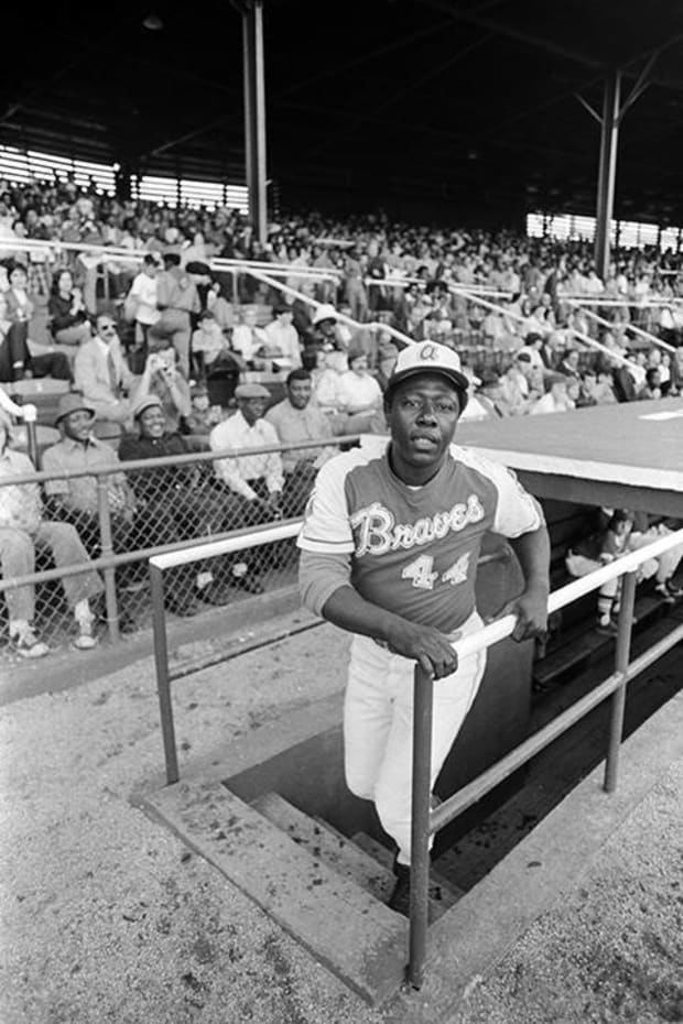 Hank Aaron climbs out of the dugout at Rickwood Field in 1974 when playing for the Braves. 