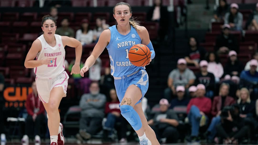 Alyssa Ustby dribbles on a fast break v Stanford
