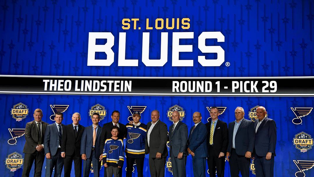 Jun 28, 2023; Nashville, Tennessee, USA; St. Louis Blues draft pick Theo Lindstein stands with Blues staff after being selected with the twenty ninth pick in round one of the 2023 NHL Draft at Bridgestone Arena. Mandatory Credit: Christopher Hanewinckel-Imagn Images
