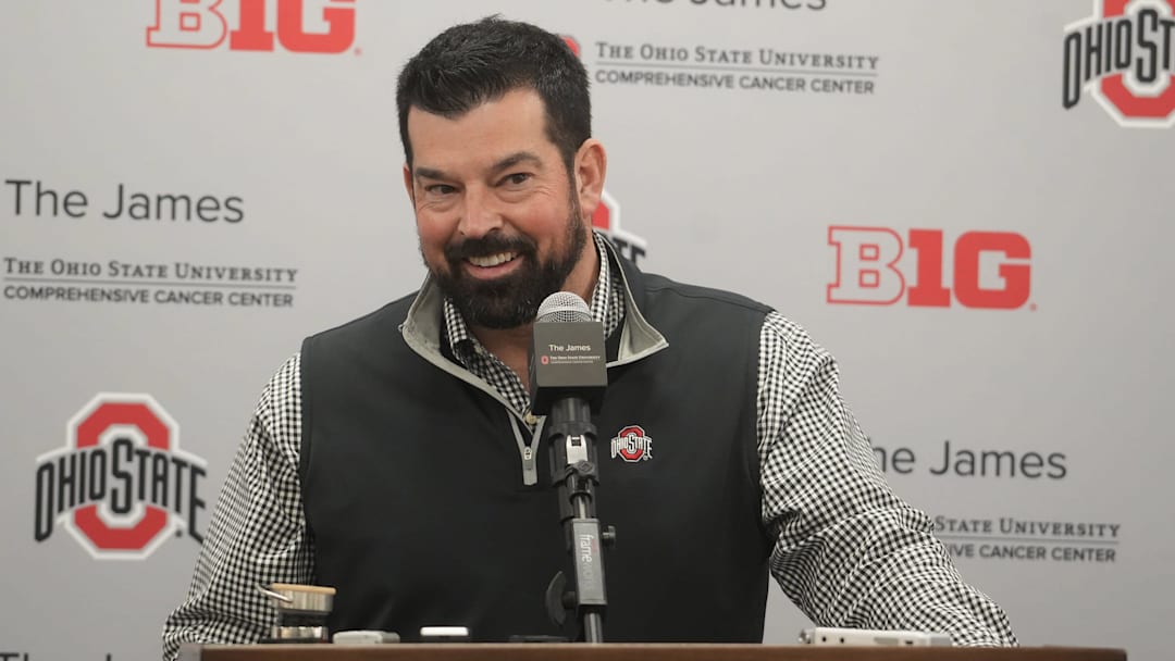 Dec 20, 2023; Columbus, Ohio, USA; Ohio State football coach Ryan Day smiles while reacting a question about the whims of high-school recruits. He held a news conference Wednesday, December 20, 2023 to discuss the class.