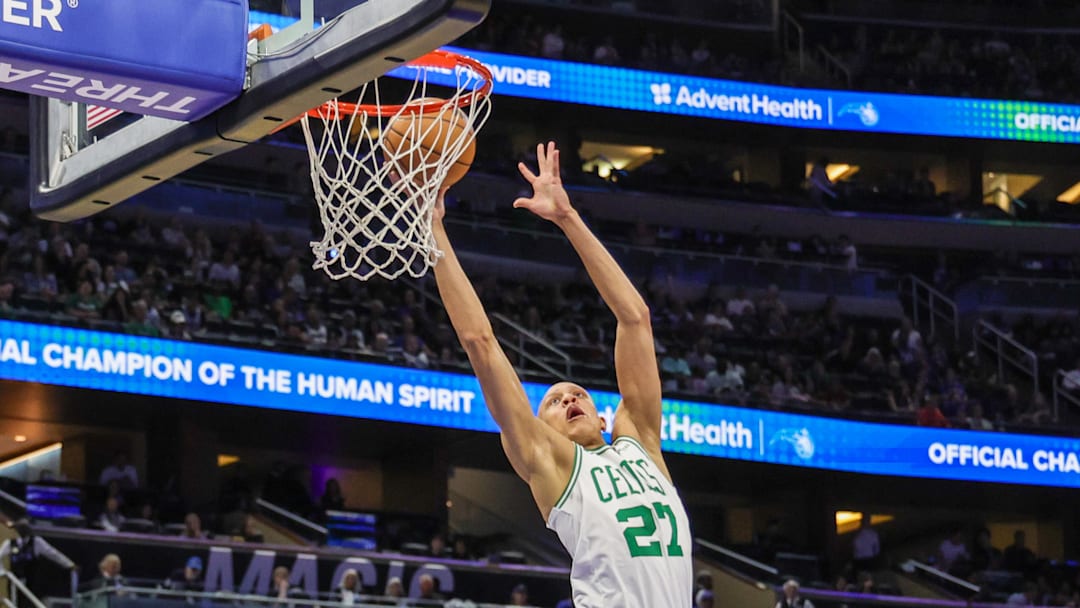 Apr 9, 2025; Orlando, Florida, USA; Boston Celtics guard Jordan Walsh (27) goes to the basket during the second quarter against the Orlando Magic at Kia Center. Mandatory Credit: Mike Watters-Imagn Images