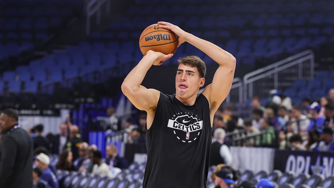 Nov 9, 2025; Orlando, Florida, USA; Boston Celtics center Luka Garza (52) warms up before the game against the Orlando Magic at Kia Center. Mandatory Credit: Mike Watters-Imagn Images Nov 9, 2025; Orlando, Florida, USA; Boston Celtics center Luka Garza (52) warms up before the game against the Orlando Magic at Kia Center. Mandatory Credit: Mike Watters-Imagn Images