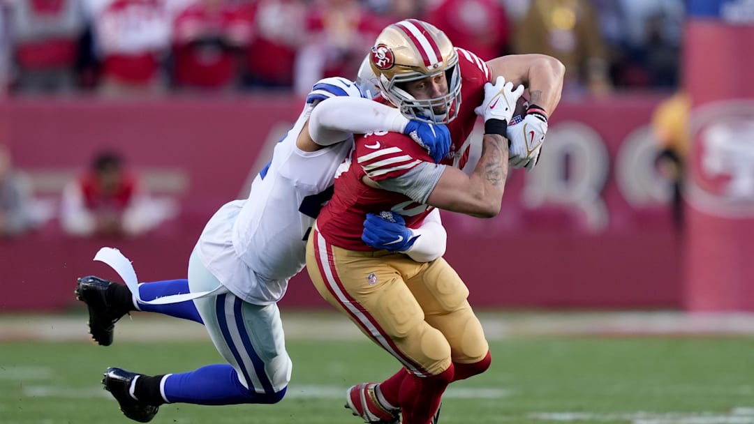 Jan 22, 2023; Santa Clara, California, USA; San Francisco 49ers tight end George Kittle (85) is tackled by Dallas Cowboys linebacker Anthony Barr (42) during the second quarter of a NFC divisional round game at Levi's Stadium. 