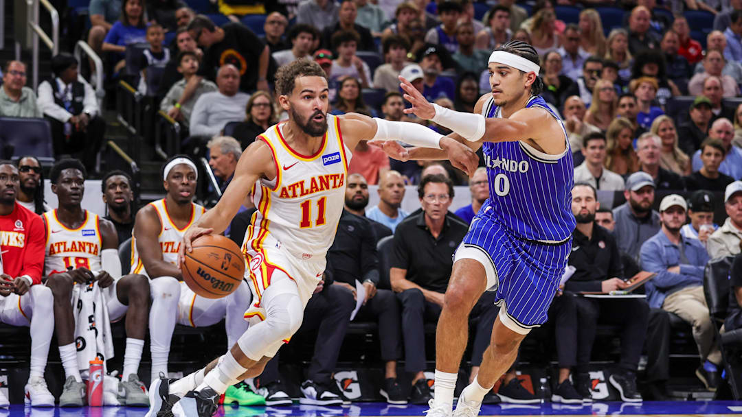 Oct 24, 2025; Orlando, Florida, USA; Atlanta Hawks guard Trae Young (11) drives around Orlando Magic guard Anthony Black (0) during the second quarter at Kia Center. Mandatory Credit: Mike Watters-Imagn Images Oct 24, 2025; Orlando, Florida, USA; Atlanta Hawks guard Trae Young (11) drives around Orlando Magic guard Anthony Black (0) during the second quarter at Kia Center. Mandatory Credit: Mike Watters-Imagn Images