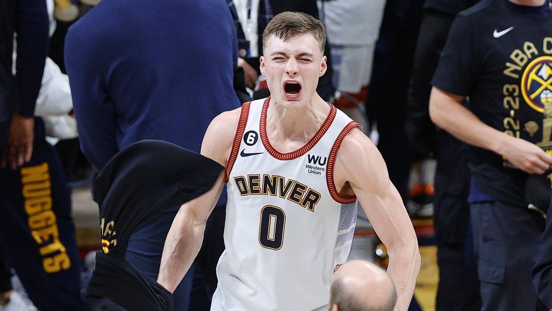 Jun 12, 2023; Denver, Colorado, USA; Denver Nuggets guard Christian Braun (0) celebrates after winning the 2023 NBA Championship against the Miami Heat at Ball Arena. Mandatory Credit: Isaiah J. Downing-Imagn Images