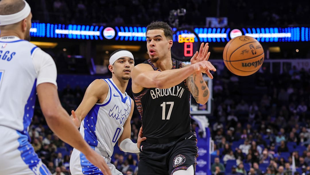 Feb 5, 2026; Orlando, Florida, USA; Brooklyn Nets forward Michael Porter Jr. (17) passes in front of Orlando Magic guard Anthony Black (0) during the first quarter at Kia Center. Mandatory Credit: Mike Watters-Imagn Images