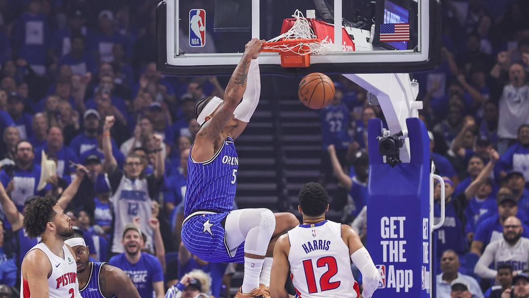 Apr 27, 2026; Orlando, Florida, USA; Orlando Magic forward Paolo Banchero (5) dunks in front of Detroit Pistons forward Tobias Harris (12) during the first quarter during game four of the first round of the 2026 NBA Playoffs at Kia Center. Mandatory Credit: Mike Watters-Imagn Images
