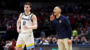 Mar 29, 2024; Dallas, TX, USA; Marquette Golden Eagles head coach Shaka Smart talks to guard Tyler Kolek (11) during the first half in the semifinals of the South Regional of the 2024 NCAA Tournament against the North Carolina State Wolfpack at American Airlines Center. Mandatory Credit: Tim Heitman-USA TODAY Sports 