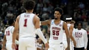 Mar 22, 2024; Spokane, WA, USA; Alabama Crimson Tide guard Aaron Estrada (55) celebrates with guard Mark Sears (1) after a play during the first half in the first round of the 2024 NCAA Tournament against the Charleston Cougars at Spokane Veterans Memorial Arena. Mandatory Credit: Kirby Lee-Imagn Images 