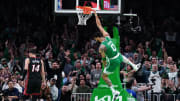 Apr 24, 2024; Boston, Massachusetts, USA; Boston Celtics forward Jayson Tatum (0) makes the basket against the Miami Heat in the first quarter during game two of the first round for the 2024 NBA playoffs at TD Garden. Mandatory Credit: David Butler II-USA TODAY Sports