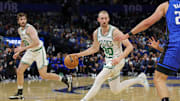 Apr 9, 2025; Orlando, Florida, USA; Boston Celtics forward Sam Hauser (30) brings the ball up court during the second quarter against the Orlando Magic at Kia Center. Mandatory Credit: Mike Watters-Imagn Images