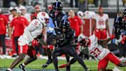 Nov 7, 2025; Orlando, Florida, USA; UCF Knights wide receiver Duane Thomas Jr. (7) avoids being tackled during the second half against the Houston Cougars at Acrisure Bounce House. Mandatory Credit: Mike Watters-Imagn Images