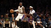 Apr 27, 2024; Los Angeles, California, USA; Los Angeles Lakers forward LeBron James (23) dribbles against Denver Nuggets guard Kentavious Caldwell-Pope (5) during the third quarter in game four of the first round for the 2024 NBA playoffs at Crypto.com Arena. Mandatory Credit: Jason Parkhurst-USA TODAY Sports