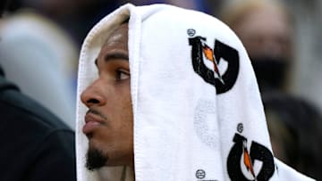 Point Guard Dejounte Murray on the bench during a match vs the Golden State Warriors 