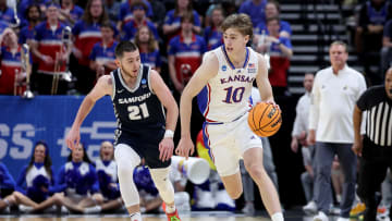 Mar 21, 2024; Salt Lake City, UT, USA; Kansas Jayhawks guard Johnny Furphy (10) dribbles against Samford Bulldogs guard Rylan Jones (21) during the first half in the first round of the 2024 NCAA Tournament at Vivint Smart Home Arena-Delta Center. Mandatory Credit: Rob Gray-USA TODAY Sports