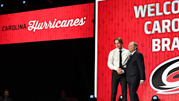 Jun 28, 2023; Nashville, Tennessee, USA; Carolina Hurricanes draft pick Bradly Nadeau shakes hands with NHL commissioner Gary Bettman after being selected with the thirtieth pick in round one of the 2023 NHL Draft at Bridgestone Arena. Mandatory Credit: Christopher Hanewinckel-Imagn Images